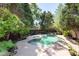 Backyard oasis with a pool and plenty of room for lounge chairs surrounded by greenery at 1159 Thornwell Ne Dr, Brookhaven, GA 30319