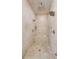 Luxurious glass-enclosed shower with beige tile and multiple shower heads and seat at 1159 Thornwell Ne Dr, Brookhaven, GA 30319