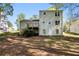 Back exterior view features a deck and a large backyard offering space for outdoor enjoyment at 2965 Carrie Farm Nw Rd, Kennesaw, GA 30144
