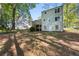Exterior back view of home features a deck overlooking the backyard, and a neutral color palette at 2965 Carrie Farm Nw Rd, Kennesaw, GA 30144