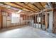 Unfinished basement space with exposed ceiling beams and framing awaiting customization to suit any need at 2965 Carrie Farm Nw Rd, Kennesaw, GA 30144