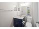 Bathroom with a sleek vanity, granite countertop, and a toilet at 2965 Carrie Farm Nw Rd, Kennesaw, GA 30144