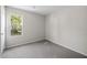 Bright bedroom with plush carpet and natural light from a large window at 2965 Carrie Farm Nw Rd, Kennesaw, GA 30144