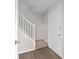 Bright entryway with hardwood floors, white door, and staircase leading to the upper level at 2965 Carrie Farm Nw Rd, Kennesaw, GA 30144