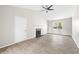 Cozy living room with fireplace, natural light, and modern ceiling fan at 2965 Carrie Farm Nw Rd, Kennesaw, GA 30144