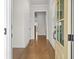 Bright foyer featuring hardwood floors, neutral walls, and a view into the main living spaces at 625 Skytop Dr, Cumming, GA 30040