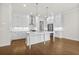 Modern kitchen with stainless steel appliances, a center island, and white cabinetry at 625 Skytop Dr, Cumming, GA 30040
