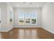 Spacious living room with hardwood floors, natural light, and a view of the beautiful backyard at 625 Skytop Dr, Cumming, GA 30040