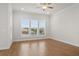 Bright living room featuring hardwood floors, large windows, and an open floor plan at 625 Skytop Dr, Cumming, GA 30040