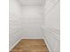 This walk-in closet features hardwood floors and wire shelving at 625 Skytop Dr, Cumming, GA 30040