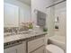 The full bath features granite countertops, painted cabinets, and a tub with shower at 108 Wheelers Dr, Dallas, GA 30157