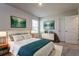 Tranquil bedroom with soft carpet, a large bed, and coordinated decor, including matching artwork and bedside lamps at 108 Wheelers Dr, Dallas, GA 30157