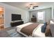 Spacious main bedroom offering a large bed, soft carpet, and ample space with tasteful decor and a ceiling fan at 108 Wheelers Dr, Dallas, GA 30157
