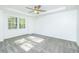 Sunlit bedroom with tray ceilings and plush carpeting at 144 Grayland Hills Ct, Lawrenceville, GA 30046