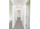 Hallway with neutral paint and doors leading to bedrooms at 144 Grayland Hills Ct, Lawrenceville, GA 30046