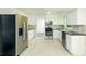 Updated kitchen with stainless steel appliances, white cabinets, and granite countertops at 144 Grayland Hills Ct, Lawrenceville, GA 30046