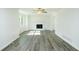 Bright living room showcasing hardwood floors, a ceiling fan, and a cozy fireplace at 144 Grayland Hills Ct, Lawrenceville, GA 30046