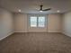 A large and spacious bedroom featuring a ceiling fan, and lots of natural light from the large windows at 1636 Fuma Leaf Way, Mcdonough, GA 30253