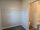 Walk-in closet featuring wire shelving and entry to bathroom with shower at 1636 Fuma Leaf Way, Mcdonough, GA 30253