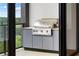 Cozy outdoor balcony area featuring a built-in Artisan grill station perfect for outdoor cooking at 2425 Peachtree Ne Rd # 1409, Atlanta, GA 30305