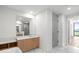 Bright, marble-accented bathroom with glass shower and modern vanity at 2425 Peachtree Ne Rd # 1409, Atlanta, GA 30305