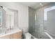 Modern bathroom featuring sleek fixtures, a glass-enclosed shower, and a floating vanity at 2425 Peachtree Ne Rd # 1409, Atlanta, GA 30305