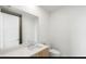 A compact bathroom featuring a modern vanity, sink, toilet, and a large mirror at 2425 Peachtree Ne Rd # 1409, Atlanta, GA 30305
