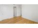 Bedroom with hardwood floors, white trim, and ample closet space at 2425 Peachtree Ne Rd # 1409, Atlanta, GA 30305