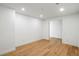 An airy bedroom with hardwood floors, recessed lighting, and an open doorway at 2425 Peachtree Ne Rd # 1409, Atlanta, GA 30305