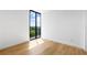 Sunlit bedroom featuring hardwood floors and a large window with beautiful views at 2425 Peachtree Ne Rd # 1409, Atlanta, GA 30305
