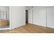 Bedroom with hardwood floors leading into an ensuite bath and large closet at 2425 Peachtree Ne Rd # 1409, Atlanta, GA 30305