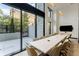 Bright conference room with a large window overlooking a landscaped exterior at 2425 Peachtree Ne Rd # 1409, Atlanta, GA 30305