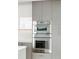 Built in stainless steel oven and microwave with light and dark colored cabinets at 2425 Peachtree Ne Rd # 1409, Atlanta, GA 30305