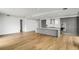 Open kitchen with large island and stainless steel appliances, with light hardwood floors at 2425 Peachtree Ne Rd # 1409, Atlanta, GA 30305