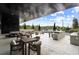 Rooftop patio with a stainless steel outdoor kitchen, lounge seating, and bar area for elegant entertaining at 2425 Peachtree Ne Rd # 1409, Atlanta, GA 30305