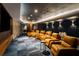 Stunning theater room featuring tiered leather seating, side tables, and a large screen for the ultimate viewing experience at 2425 Peachtree Ne Rd # 1409, Atlanta, GA 30305