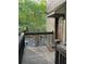 Exterior of a house with wood siding, a brown front door, and a porch at 2704 Cumberland Se Ct # 27, Smyrna, GA 30080