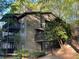 Inviting three-story condo with multiple decks nestled amongst lush green trees at 2704 Cumberland Se Ct # 27, Smyrna, GA 30080