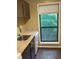 Bright kitchen with granite countertops, stainless steel sink, and natural light from the window at 2704 Cumberland Se Ct # 27, Smyrna, GA 30080