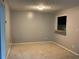 Cozy living room with neutral carpet and pass-through window to the kitchen at 2704 Cumberland Se Ct # 27, Smyrna, GA 30080