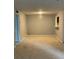 Spacious living room with neutral carpet and passthrough window at 2704 Cumberland Se Ct # 27, Smyrna, GA 30080
