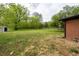 A spacious backyard features a well-maintained lawn at 80 E Howard St, Kingston, GA 30145