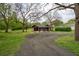 A house with a long driveway and big front yard at 80 E Howard St, Kingston, GA 30145