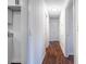 A bright hallway with white walls, paneled walls and hardwood floors throughout the space at 80 E Howard St, Kingston, GA 30145