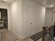 Hallway with neutral paint and carpeted floor leads to the bedroom at 1297 Ascot Ter, Atlanta, GA 30329