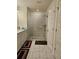 Main bathroom features a glass shower, marble floors, and white vanity at 1297 Ascot Ter, Atlanta, GA 30329