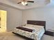 Spacious main bedroom offers trey ceilings, ceiling fan, and attached bathroom at 1297 Ascot Ter, Atlanta, GA 30329