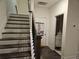 Staircase with wooden banister leads to the upper level of the home at 1297 Ascot Ter, Atlanta, GA 30329