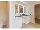 Bright bathroom featuring double vanity, granite countertops and modern lighting at 1613 Fuma Leaf Way, Mcdonough, GA 30253