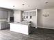 Modern kitchen featuring gray cabinets, granite countertops, and stainless steel appliances at 1613 Fuma Leaf Way, Mcdonough, GA 30253